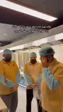 In this candid moment from الرمــــــــال-restaurant ⚓️, a manager is seen trying to de-escalate a tense situation between his employees. While they stand in their uniform yellow shirts and blue hairnets in the kitchen, he explains his actions, stating he had to 'break them up' and tell them to calm down. The scene captures a real-world challenge of workplace management. by @sandshawarma with Original Sound by sandshawarma