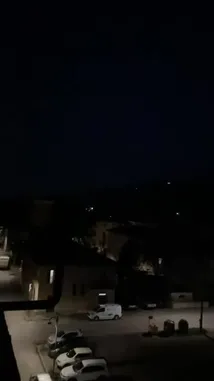 This short, atmospheric clip captures a quiet city street at night from an elevated viewpoint. As the camera remains still, a series of powerful Arabic motivational quotes appear on screen, each accompanied by its English translation. The text includes messages like 'He arranges the most beautiful destinies for his owner,' 'If your intention is good, do not be afraid,' and 'Good intentions win.' The overall mood is reflective and encouraging, blending the peaceful urban environment with a message of hope and perseverance. by @tr3i5 with tr3i5 by Original Sound