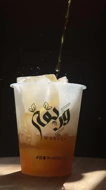 This video shows the step-by-step process of crafting a refreshing iced coffee beverage. It begins with freshly ground coffee beans and transitions to the final product: a glass of iced coffee served over ice, showcasing the rich color and inviting bubbles. The entire preparation is presented in a visually appealing manner, highlighting the quality of the ingredients and the final drink. by @wareqa.sa with Original Sound by wareqa.sa