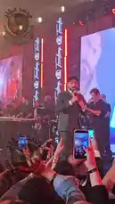 Experience the electrifying atmosphere of Mohamed Fouad's live concert. This video captures the singer passionately performing his hit song 'Shoftou Aishk' on stage, surrounded by a full band and a massive, engaged audience. Fans are seen recording the moment on their phones, singing along, and enjoying the vibrant energy of the event. by @mo.fouadziko with Original Sound by mo.fouadziko