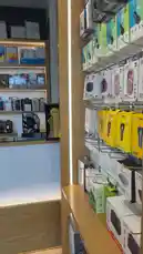 Explore the Simple Store, a modern retail space brimming with tech accessories. This walkthrough showcases a wide array of products including headphones, power banks, car chargers, and more, all neatly displayed on wooden shelves. A store employee interacts with a product box, highlighting the hands-on experience offered at Simple Store. by @power.ch01 with Original Sound by power.ch01