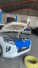 Get an inside look at the daily operations at Wasta Hawkar's auto repair shop. This walkthrough showcases multiple vehicles undergoing servicing, including a rally-prepped car with its hood open, highlighting the skilled workmanship and professional environment. See the tools, banners, and workflow of a modern garage. by @hawkar_service with Original Sound by hawkar_service