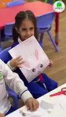 This video showcases children engaged in various educational activities at Ajyal Al-Faisaliah Private Schools. It features a young boy playing with a toy kitchen set, a girl coloring animal pictures, and other students participating in arts and crafts projects. by @ajyalf with Original Sound by ajyalf
