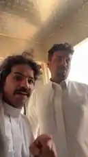 In a charmingly simple kitchen with diamond-plate walls, a joyful reunion unfolds between two men dressed in traditional attire. One man, wearing a white thobe and a patterned headscarf, playfully surprises his friend, who is wearing a blue thobe and a tan headscarf while cooking. They share a warm hug and laughter, capturing a genuine moment of brotherhood and cultural pride. This touching scene celebrates friendship, family bonds, and the beauty of everyday life. by @manahi.20 with manahi.20 by Original Sound