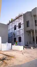 Witness the incredible journey of a modern home's transformation. This video chronicles the construction process, showing workers on scaffolding building the structure, before revealing the final, elegant result. The completed house boasts classical architecture with prominent columns, a grand entrance, and a beautifully landscaped front yard, showcasing a remarkable architectural upgrade. by @insugreen with Original Sound by insugreen