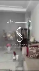 A beautifully curated wedding celebration setup for Lamis & Majed on August 13, 2026. The video showcases elegant decor elements including a 'Today a bride, Tomorrow a wife' sign, a floral bouquet, a cake with personalized Arabic candles, a bridal jewelry display, and a drinks cart with custom invitations. by @me_ha73 with Original Sound by me_ha73