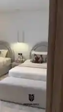 Explore a beautifully styled modern bedroom featuring twin beds with unique curved headboards and coordinated animal-themed decor. The tour continues to a sleek study area with a contemporary desk, chair, and built-in shelving, all showcasing cohesive interior design principles. von @designskill mit بتوحشيني von فضل شاكر