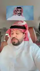 A man identified as Hamad Al-Dabhan, wearing traditional Saudi attire including a white thobe and a red-and-white checkered ghutra, sings a heartfelt Arabic song while seated inside a car. The interior of the vehicle features brown leather seats, and the camera focuses on his expressive performance. by @hamed_aldaban with Original Sound by hamed_aldaban