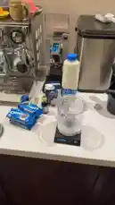 In this quick tutorial, يُوسف عبدالرحمن demonstrates how to make delicious homemade Oreo ice cream. The process starts with placing an Oreo cookie into a blender cup on a digital scale, followed by adding milk and other ingredients. With a professional espresso machine in the background, he prepares to blend the mixture, promising to share the final result tomorrow. by @alysf90 with Original Sound by alysf90