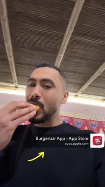 In this short, informative clip, دحومي999 demonstrates a simple yet effective technique for eating a burger. He holds the burger close to his mouth and takes a bite, showcasing a method that keeps things neat and delicious. The video is shot in a casual indoor setting with a wooden ceiling, creating a relaxed atmosphere. A Burgerizr App advertisement is visible throughout, suggesting a partnership or sponsorship. This quick tutorial offers viewers a practical tip they can apply immediately. by @d7oomysnap with d7oomysnap by Original Sound