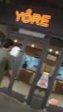 A man walks into the YORE restaurant and orders chicken strips. The video shows the preparation process, including breading and frying the chicken. He then enjoys the finished dish, which includes fries and dipping sauces. The video ends with contact information for YORE locations. by @yore.ksa with Original Sound by yore.ksa
