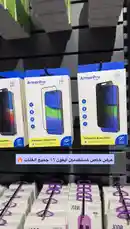 A hand points to various ArmorPro tempered glass screen protector packages displayed on a retail shelf, highlighting different models compatible with iPhone 2024 devices. This visual guide helps customers compare options like 'Full Coverage' and 'Edge-to-Edge' protection before making a purchase. by @aldamanstore with Original Sound by aldamanstore