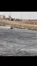 In a stunning display of vehicle control, فيصل 🥷🏻F expertly maneuvers his white pickup truck through a series of tight drifts on a vast, dusty proving ground. The truck leaves intricate tire marks across the terrain as it powers through the course, showcasing impressive handling and skill. by @zf_v81 with 😔✌🏻. by 2016