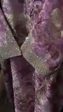 A stylish showcase of Abtsam Al Manhali's elegant bridal ensemble. The video features a stunning purple floral dress with intricate gold beadwork, a luxurious diamond necklace set, and chic pink bow heels, all presented in a glamorous setting. by @ab.7955 with original sound