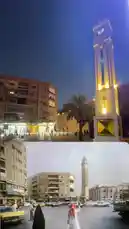This split-screen video presents a powerful comparison of a city square across time. The top half shows the modern, illuminated night scene with contemporary buildings and cars. The bottom half reveals the same location in the past, featuring vintage vehicles and people in traditional attire. A prominent clock tower stands as a constant landmark, anchoring the scene through decades of change. by @hamed_aldaban with تذكرت الزمان by حامد الضبعان
