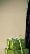 A woman in traditional attire unboxes a collection of beauty products from 'Natural Touch' and 'Pink Lily', including rice milk & caladium soap, amla oil, and body wash. The video highlights a promotional campaign for Saudi Founding Day, showcasing gift ideas for the occasion. by @naturaltouchsa with naturaltouchsa by Original Sound