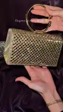 DIANA presents a stunning collection of elegant clutch bags. This video features close-up shots of three distinct designs—a silver mesh, a black glitter, and a gold mesh clutch—each adorned with a unique ring handle. The accessories are displayed against a luxurious purple satin backdrop, highlighting their sparkle and sophisticated details. by @bydiana.co with Original Sound by bydiana.co