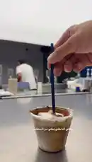 Watch as a hand stirs a delicious cup of tiramisu iced coffee with a blue straw. This simple yet elegant drink combines the rich flavors of coffee and cocoa powder, perfect for coffee lovers looking to elevate their home-brewed beverages. A great tutorial for anyone interested in making specialty coffee drinks. by @alysf90 with Original Sound by alysf90