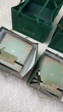 A stylish showcase of PYONE luxury products, including a gift set with oud incense and a fragrance bottle, presented alongside an elegant tea service with cookies and chocolates. The scene captures a sophisticated lifestyle moment. by @bee.8907 with Original Sound by bee.8907