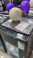 This video provides a detailed look at a KROME 7kg fully automatic washing machine during a 'Mega Sale' event at a GEFPAS appliance store. A hand points out key features on the control panel and highlights the sale price tag of 750 SAR. The camera pans across multiple units decorated with purple and white balloons, showcasing the product in a retail setting. by @dalilnet with Original Sound by dalilnet