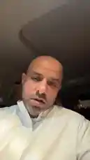 This is a candid, selfie-style video of Bader Alodah filmed inside a car at night. He is wearing a white collared shirt and speaks directly to the camera with expressive hand gestures, including touching his face and adjusting his collar. The lighting is dim, focused on him, while the background shows the dark interior of the vehicle and faint city lights through the windows. His tone and delivery suggest he is sharing a personal thought, story, or commentary. by @guruofmarketing with Original Sound by guruofmarketing