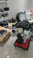 In this workshop vlog, Khaled showcases the unboxing of a new water pump for his car engine. The video provides a detailed look at the component before installation, highlighting its features and condition. by @khllo17 with Original Sound by khllo17