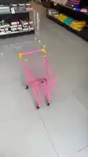 This walkthrough takes you inside the Brown Chocolate store, showcasing its wide selection of products. The shopper picks up various items including gift boxes, traditional pastries like maamoul, cookies, and other confectioneries, placing them into a pink shopping cart. On-screen text displays prices in Riyals, providing a real-time look at the shopping experience. by @ch11.30 with Original Sound by ch11.30