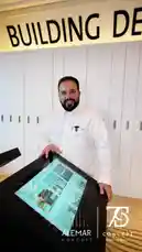 Watch this engaging presentation by Alemar Concept, where a professional demonstrates their building design services using an interactive digital kiosk. The modern office setting highlights their focus on innovative solutions for construction and development projects. by @alemarconcept with alemarconcept by Original Sound