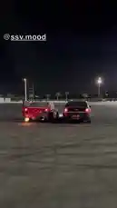 In a vast, empty parking lot under the cover of night, two modified sedans face off in a display of raw power and drifting skill. With their doors open and tires screeching, they perform synchronized burnouts, filling the air with smoke and the roar of revving engines. This is a high-octane performance from M, showcasing the thrill of street-style car culture. by @mo_kbs8 with Original Sound by mo_kbs8
