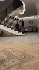 Experience a heartwarming scene of family fun inside a modern home. Watch as a young boy excitedly rides his illuminated scooter, followed by his father in traditional attire who playfully joins in the ride. Their joyful interaction captures the essence of simple, loving moments shared between a parent and child. by @eid_saud with Original Sound by eid_saud