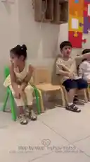 A lively scene from the 'Step by Step' child care center where young children are actively engaged in various fun activities. The video shows kids sitting together, playing games like ball throwing and catching, and running around in a bright, colorful classroom environment. It captures the joyful energy and interactive learning moments typical of a modern preschool setting. by @stepbystepkh with Original Sound by stepbystepkh