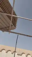 This fast-paced, point-of-view video offers a glimpse into the dynamic environment of a construction site managed by 151 Constructions & General Ma. The footage begins with a close-up of a modern pergola structure under a clear sky, then cuts to scenes inside a large warehouse filled with paint supplies and tools. An orange backhoe loader is shown maneuvering a large pallet wrapped in plastic, followed by a shot of a KATO mobile crane parked on a paved area. The video provides a raw, energetic look at the equipment and activity involved in general construction work. by @construct151 with construct151 by Original Sound