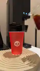 Watch as coffee is poured into a red cup with a panda logo, demonstrating a simple method for preparing cold brew coffee using a home machine. by @alysf90 with Original Sound by alysf90