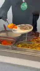 Watch a staff member at Proteinz, a healthy meal delivery service, expertly assemble a nutritious plate. This step-by-step look at their food preparation process showcases fresh ingredients like seasoned meat, vibrant orange rice, and yellow pasta, all served in a clean, professional environment. It's a perfect visual guide for anyone interested in healthy eating, meal prep, or learning how to build a balanced diet. by @proteinz_sa with original sound
