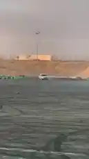 In a stunning display of automotive skill, فيصل 🥷🏻F takes his white pickup truck for a high-octane drift session on a dusty, open-air track during golden hour. The vehicle performs wide, controlled slides, kicking up thick clouds of dust and smoke as it weaves around the course. The arid landscape and dramatic lighting create a cinematic atmosphere, showcasing both the power of the truck and the driver's precision. by @zf_v81 with Original Sound by zf_v81