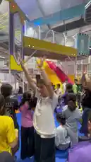 Experience the excitement of a children's party at an indoor playground! This energetic scene features kids dancing and celebrating with a performer in a vibrant, multi-level play structure. The fun atmosphere is perfect for family entertainment. by @gioco_23 with Original Sound by Contains: Aram Sam Sam - Gasca Zurli