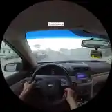 This immersive point-of-view footage captures a driver navigating city streets in a modern Chevrolet vehicle. From behind the wheel, viewers experience real-time driving dynamics, including steering, gear shifting, and interaction with the car's infotainment system. The journey unfolds during sunset, casting golden light across urban landscapes and highlighting the interior details of the dashboard and controls. This authentic driving perspective offers insight into daily commuting, navigation techniques, and vehicle handling in a bustling metropolitan environment. by @kfl1 with original sound