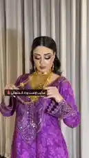 In this stylish lookbook, makeup artist وداد المنهالي (WEDAD) demonstrates how to wear a stunning, multi-layered gold statement necklace. She pairs it with a vibrant purple traditional dress to create a bold and elegant ensemble perfect for special occasions. by @wedad_23g with Original Sound by wedad_23g