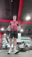 Watch Inam Sultan's fitness journey as he shares his gym workout routine, including dumbbell exercises and shoulder stretches with a trainer. The video then transitions to an outdoor vlog where he speaks directly to the camera amidst lush greenery. by @by.sul with by.sul by Original Sound