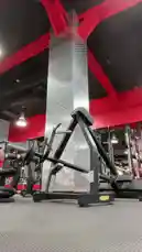 A young man performs a series of exercises in a well-equipped gym. He begins on a cable crossover machine, then transitions to standing dumbbell curls. The gym features red structural beams and modern equipment, creating a dynamic workout environment. by @by.sul with by.sul by Contains: Lost in the Fire - Gesaffelstein & The Weeknd