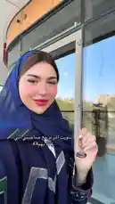 Watch Sujha Design share a stylish moment at a modern café. She enjoys a coffee date with a friend, showcasing her elegant purple hijab and fashionable black patterned top. The scene captures the relaxing ambiance of a contemporary outdoor seating area, perfect for a casual catch-up over drinks. by @soja_design with Original Sound by soja_design