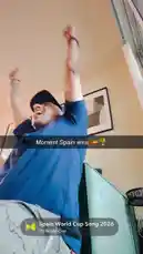A man wearing a blue shirt and black cap dances enthusiastically indoors to the 'Spain World Cup Song 2026' by DJ World Cup. He raises his arms in celebration, clearly enjoying the upbeat music. by @buddhaknows24 with Spain World Cup Song 2026 by DJ World Cup