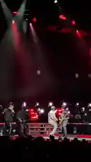 Witness a dynamic live concert performance featuring Alison Rossum on stage. She commands the spotlight with powerful vocals and energetic movement, interacting with her band and the enthusiastic audience. The scene is set against a dramatic red-lit backdrop with sweeping spotlights, creating an immersive atmosphere perfect for a memorable musical event. by @alison.rossum with original sound