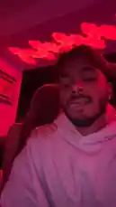 In this candid, selfie-style clip, Justin Marc shares a moment with friends in a dimly lit room illuminated by striking red ambient lighting. He smiles and interacts with others around him, capturing the fun and relaxed energy of a social gathering. The scene feels spontaneous and personal, showcasing genuine camaraderie. by @sexxyjustin with Original Sound by sexxyjustin
