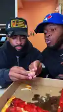 Two men review a pepperoni pizza from Burattino Brick Oven, discussing its quality and flavor while showing behind-the-scenes footage of it being prepared. They taste different variations, including one with garlic and another with a special dark sauce. by @marvedtv with Original Sound by marvedtv