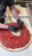 Watch a professional chef meticulously prepare a massive 'Viral 120 Pepperoni Pizza' in a commercial kitchen. This step-by-step demonstration shows the exact technique used to create the perfectly layered pepperoni ring that has taken social media by storm. by @marvedtv with Original Sound by marvedtv