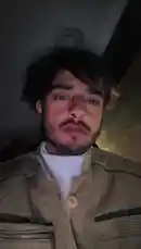 In this intimate, self-shot clip, Uzair captures a candid moment from inside a car at night. Dressed in a white turtleneck and a tan jacket, he looks directly into the camera with a contemplative expression before running his hands through his dark hair. The dim lighting and shaky camera create a raw, personal atmosphere. by @uzairr271 with uzairr271 by Original Sound