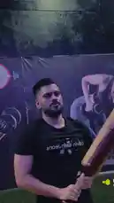 In this dynamic clip, fitness influencer D SUN 🇦🇪🇮🇳 showcases his strength and form using a large wooden bat. Set against a gym backdrop with a motivational poster, he performs a series of powerful overhead swings, highlighting his upper body power and athletic conditioning. by @dsunmusic with Original Sound by Contains: MF Gabhru! - Karan Aujla x Ikky