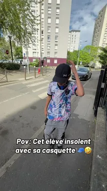 A student wearing a Paris Saint-Germain jersey and a baseball cap gets into a heated argument with a teacher named IZER. The confrontation escalates after the student refuses to remove his cap, leading to a tense hallway chase and a final disciplinary meeting in an office. by @izerflyy with Original Sound by izerflyy