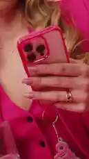 In this candid moment, Emma shares her reaction to social media comments about her singing abilities, all while dressed in a vibrant pink suit against a matching pink backdrop. She sips water from a glass with a straw as she reads the feedback, creating a relatable 'day in the life' style video that captures her personality and engagement with her audience. by @emmaaamusic with original sound